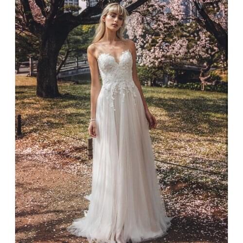 Tulle O Neck A-line Wedding Dresses Lace Appliques Bridal Gown Sleeveless Robe De Mariage Sexy Backless Wedding Gown 2021