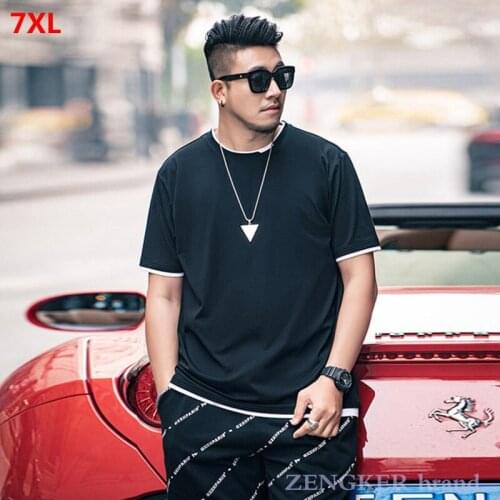 Summer plus size mens 7XL black white plus size short-sleeved T-shirt male loose hit color fake two-piece compassionate shirt