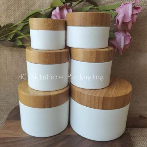 Wholesale Cosmetic Cream Jar With Bamboo Lid White PP Plastic Container Skin Care Packaging Jars Custom Logo Jars