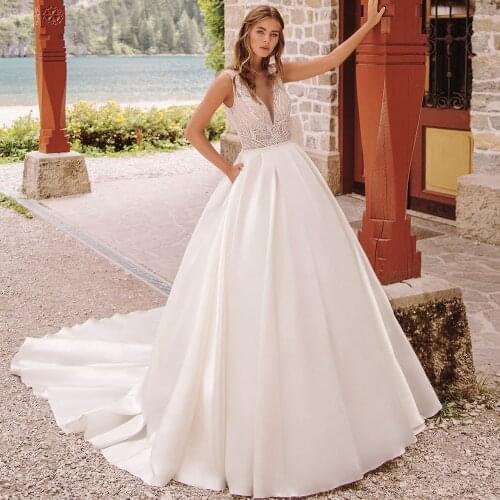 KapokDressy Ball Gown Wedding Dresses Sexy V Neck Off Shoulder Backless with Pockets Applique Sequined 2021 Hot Sale Bridal Gown