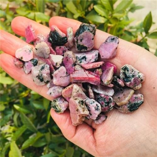 Natural crystal rose garnet raw stone decorations small particles through the body mineral wool stone landscape