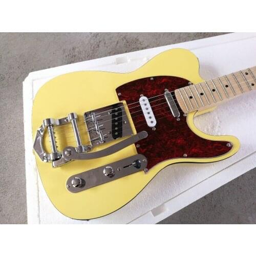 Factory customized yellow vibrato electric guitar and white card, rose wood finger plate, free delivery
