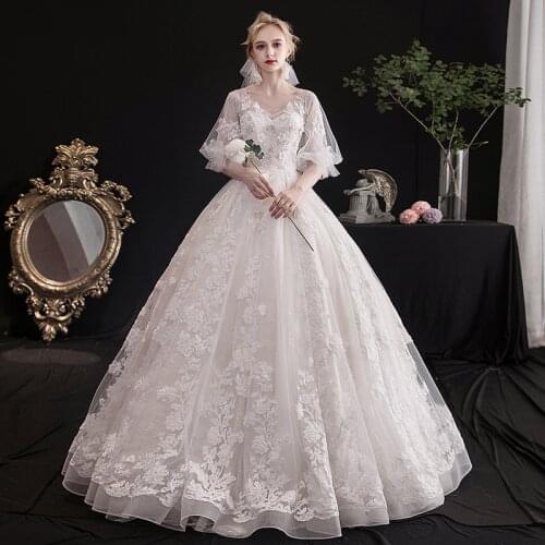 2021 New Fashion Wedding Dress Sexy Illusion V-neck a Line Floor Length Half Sleeve a Line Bridal Dresses Backless