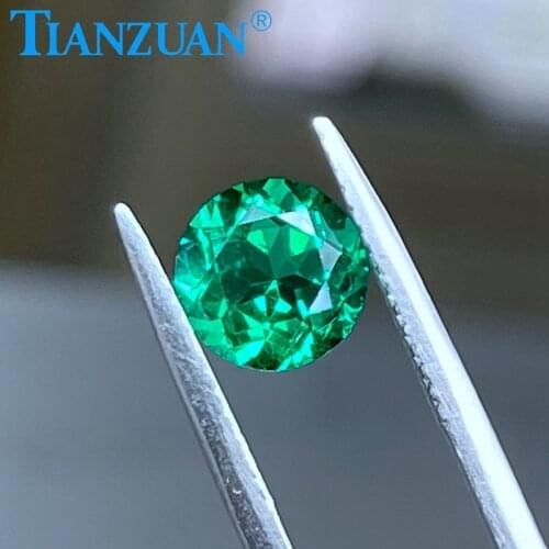 Round shape Created Hydrothermal Columbia Emerald with minor cracks and inclusions inside of it loose gemstone