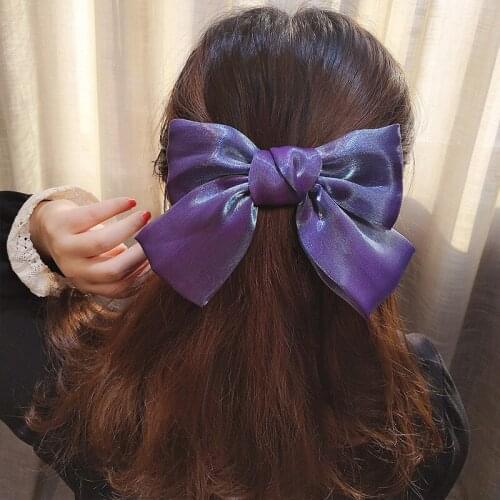 Korean version of the new pearl bright surface big bow spring clip solid color texture satin hairpin hair accessories