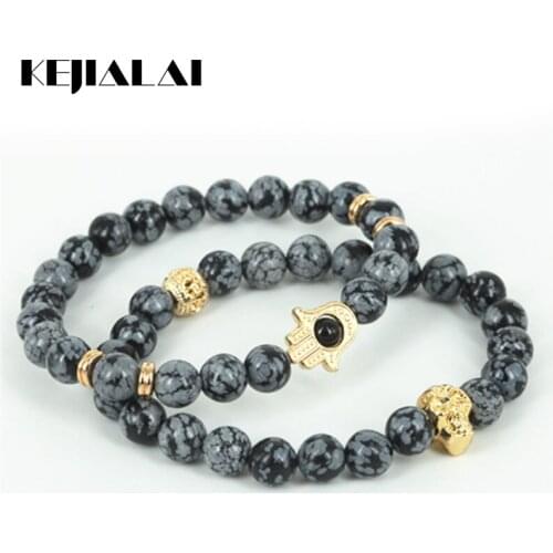 KEJIALAI 2pcs Natural Snowflak Round Stone Beads Men Hamsa Hand Bracelet Beaded Gold Skull Head Charm Women Bracelet A0576