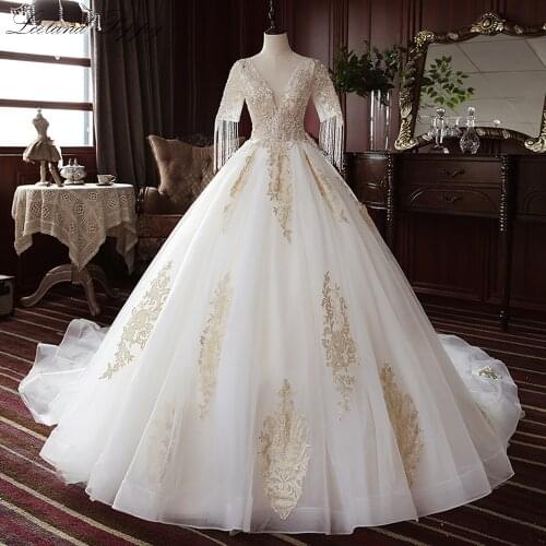 Lceland Poppy A-line V-neck Tulle Wedding Dresses 2020 Lace Appliques Beaded Floor Length Bridal Gowns with Tassel Corset Back