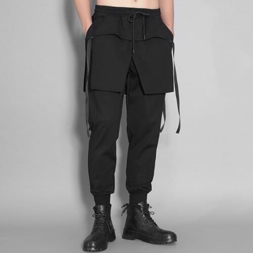 Autumn and winter men elastic waist stereo clipping false two splicing small foot pants nine minutes of sports pants