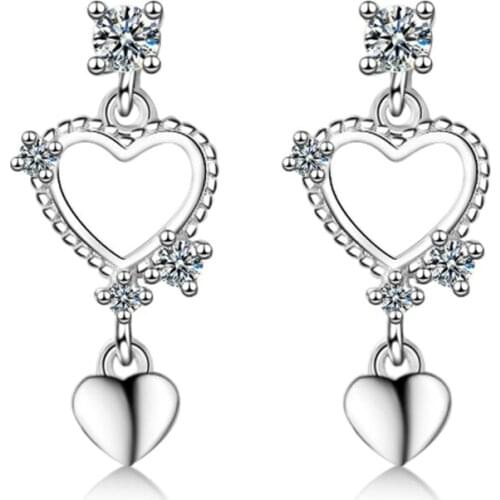 Japanese and Korean personality fashion sweet wild crystal heart-shaped love short silver plated stud earrings WE080