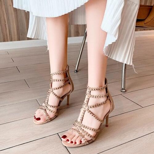 Fashion sandals 2021 new womens shoes Europe and the United States sexy hollow metal rivet high heels fashion stiletto banquet