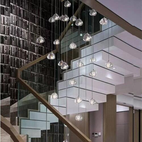 Modern K9 crystal ball chandelier is used in villa hotel lobby living room restaurant duplex staircase lounge long hanging lamp