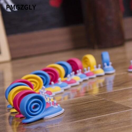 3Pcs/lot Soft Plastic Baby Home Safety Door Stopper Protector Children Safe Snail Shape Door Stops Baby gate corner protector