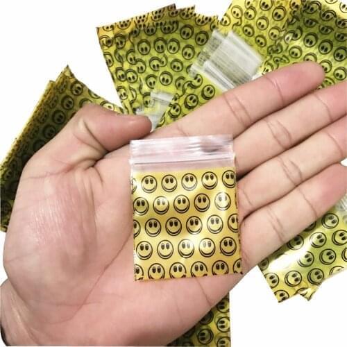 1 pack (100 pieces) hot new tobacco bag tobacco sealed bag storage bag Smile pattern with holder tobacco bag Multifunction bag