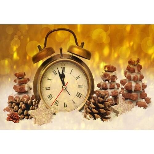 The clock Chocolate Christmas tree presents are posed for a holiday photo of a newborn in the background