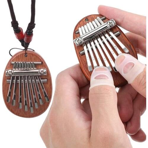 Mini 8-tone Thumb Piano Necklace Flat-panel Portable Finger Piano Music Inspired Educational Toy