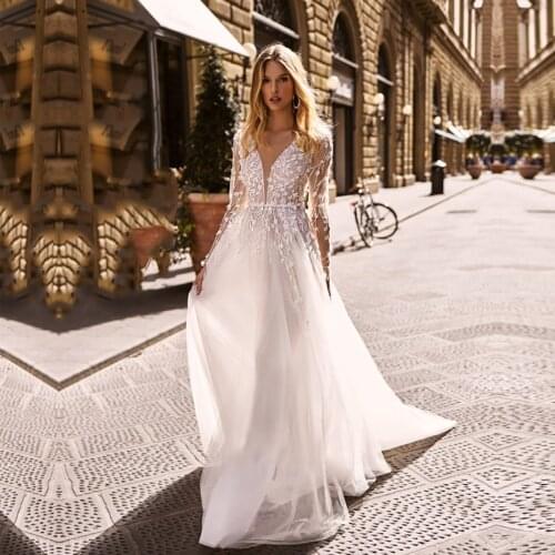 Sexy A Line Wedding Dresses 2021 coop Long Sleeves Lace Appliques Bridal Gown Court Train Button Illusion Vestido De Noiva