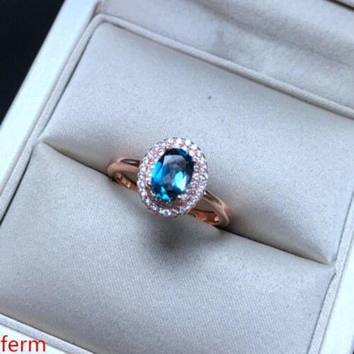 KJJEAXCMY fine jewelry 925 sterling silver inlaid natural blue topaz ring with smooth curves and a bold oval shape