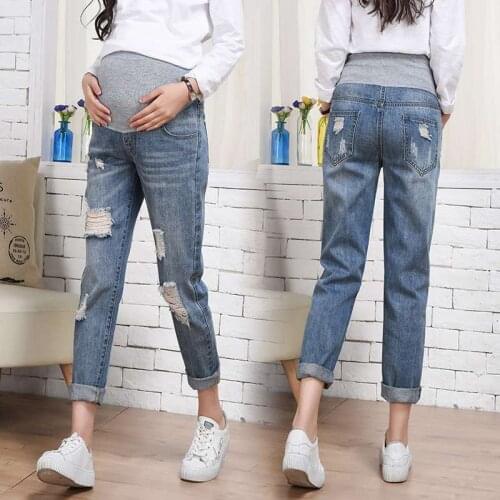 2018 pregnant women jeans autumn new tide mother Korea hole loose stomach lift pants