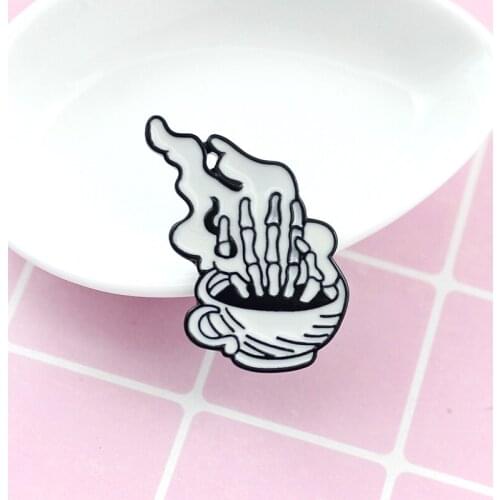Steaming coffee cup inside Pop up a hand bone Fashion personality exaggerated brooch for people with personality to match clothe