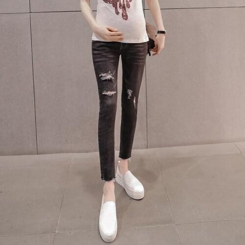 Hole pregnant women jeans spring 2018 new tide mother stomach lift pants nine pants pants stretch feet pants wear