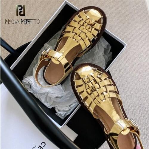 Golden black hollow woven sandals summer 2021 new retro patent leather wild sports flat buckle Roman shoes