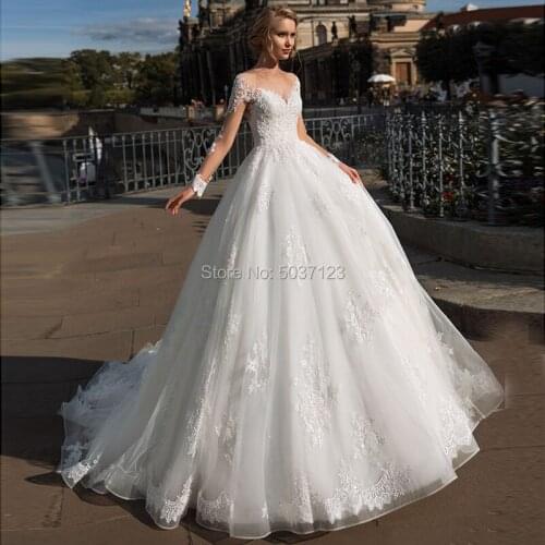 Vestido De Noiva Ball Gown Wedding Dresses Lace Appliques Sweetheart Long Sleeves Button Illusion Chapel Train Robe De Mariee