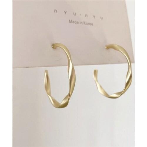 Exaggerated European and American style ins wind metal twisted matte matte earrings temperament simple semicircular earrings