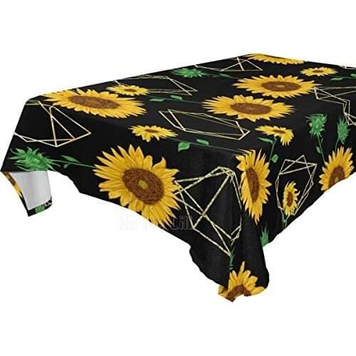 The Tablecloth Is Decorated With Sunflower Flowers For Family Gatherings