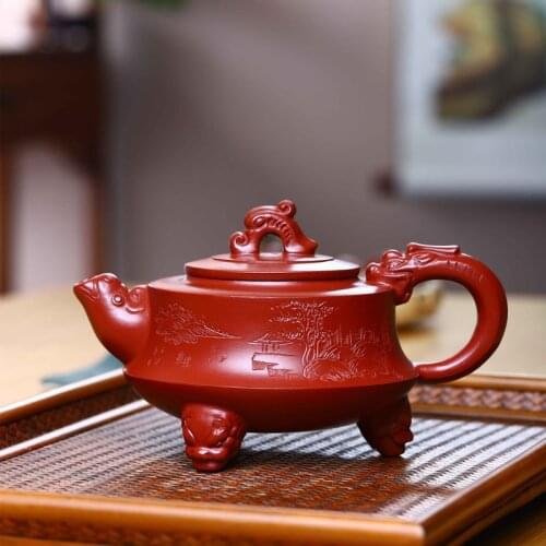 Manufacturers selling 】 manual teapot undressed ore dahongpao three-legged bronze pot of tea undertakes to dragon