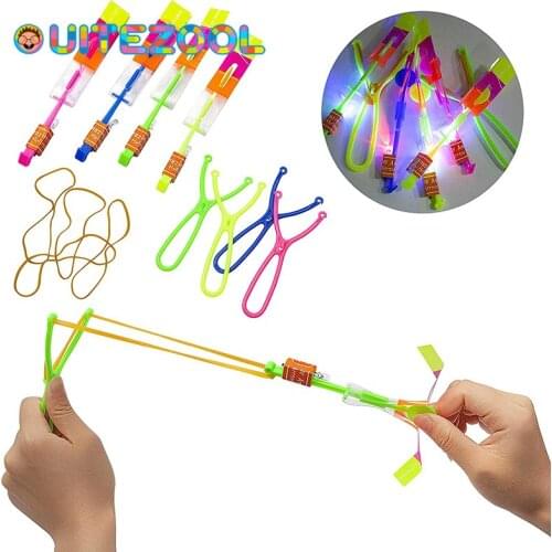 10PCS Outdoor Shining Rocket Flash LED Light Night Kids Luminous Slingshot Toys Shine Slingshot Elastic Helicopter Rotating Toy