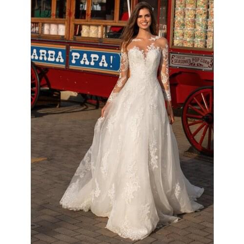 Lace Wedding Dress A Line Illusion Sweetheart Bodice Gorgeous Long Sleeves Appliques Sheer Back Wedding Party Gown Robe Mariee