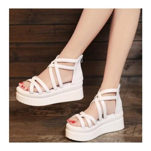 Summer women are sandals with casual chunky wedge-heels and crossed unlaced zipper sandals