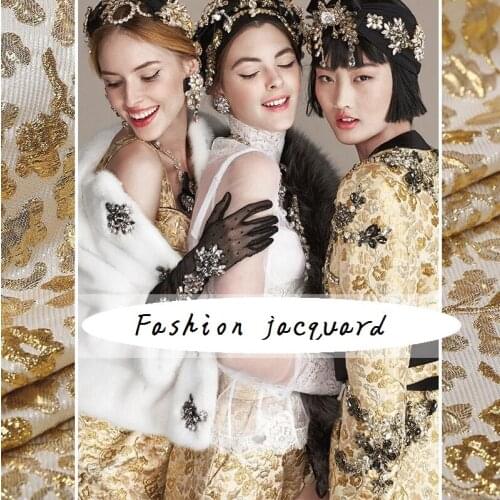 The new luxury gold bump 3D fashion fabrics luster brocade jacquard fabric shows golden coat stiffness