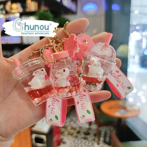Creative Cute Sakura Rabbit Keychain Luxury Floating Oil Floating Bottle Cartoon Doll Key Chain for Woman Bag Key Chain Pendant