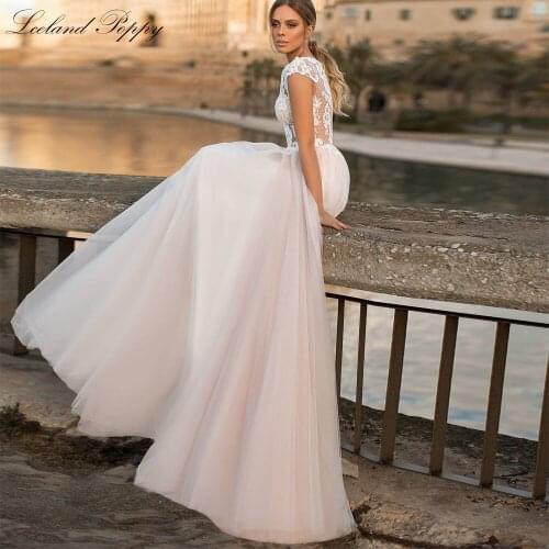 Lceland Poppy A-line Illusion Lace Wedding Dresses 2021 Sleeveless Floor Length Tulle Bridal Gowns with Court Train