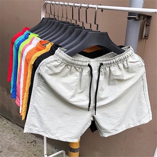 Mens summer fashion trend color beach shorts casual personality solid color loose thin section breathable quick-drying shorts