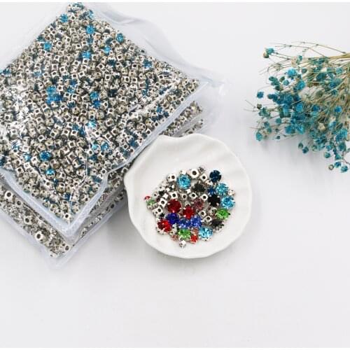 Wholesale Silver base round shape high-quality crystal glass sew on rhinestones,diy/garment accessories