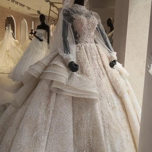 Bling Bling Glitter Wedding Dress High Neck Sheer Puffy Tulle Long Sleeves Luxury Crystals Bridal Gown with Peplum Design