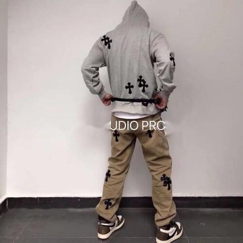 Vintage overalls worn and loose casual jeans with self-made crucifix patchwork leather vintage overalls