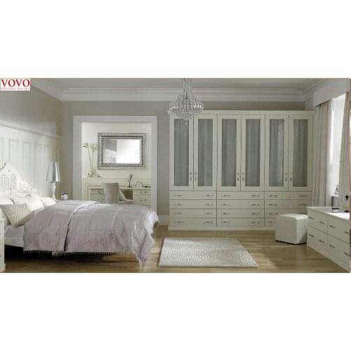 White bedroom closet with plywood carcass