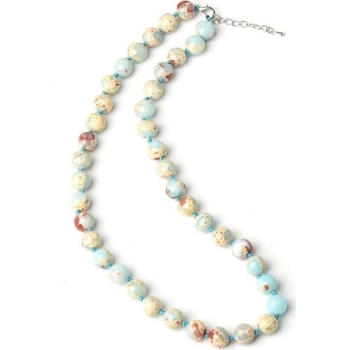 10 MM Blue Syn-thetic emperor stone Necklace It have a Mix of blue and Gold and Red beads it can Customized