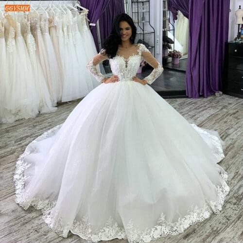 Gorgeous White Wedding Dresses 2020 Lace Appliqued Tulle Ball Gown Ivory Bride Dress Long Sleeves Arab Custom Made Wedding Gowns