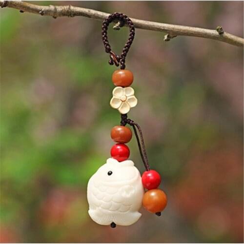 Car keychain pendant cute natural ivory fruit small fish bag ornaments safe and auspicious jewelry gifts