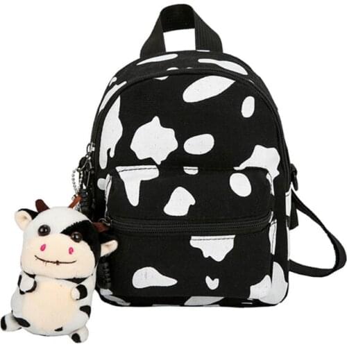 Mini Canvas Daypack with Plush Pendant Cow Print Backpack for Women Lady Girls Outdoor Travel Shopping