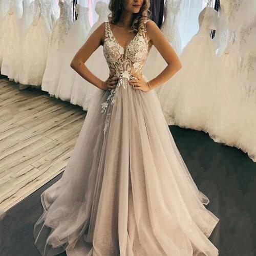2021 Tulle V Neck Beach Wedding Dresses for Bride Ivory Lace Appliques Sexy SleeveLess Backless Sweep Train Sequined Bridal Gown
