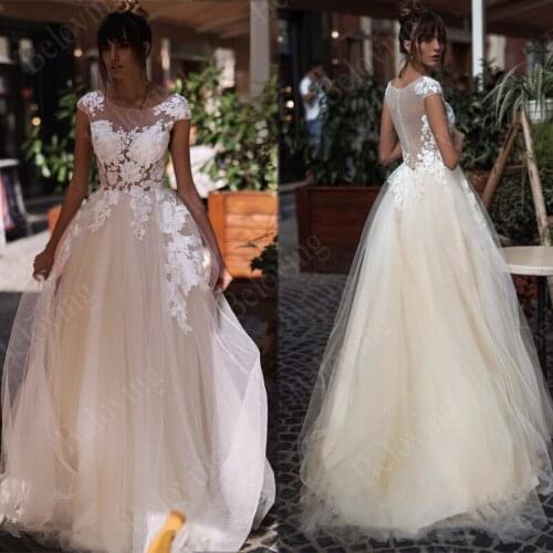 Charming Ivory Appliques & Champagne Tulle Wedding Dresses Bridal Gowns Nude Back Button Bride Dress 2021 Vestido de Noiva Longo