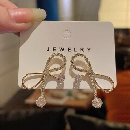 2021 New Female Korea Temperament High Sense Bow Flashing Diamond Earrings Personalized Internet Celebrity Silver Needle Jewelry