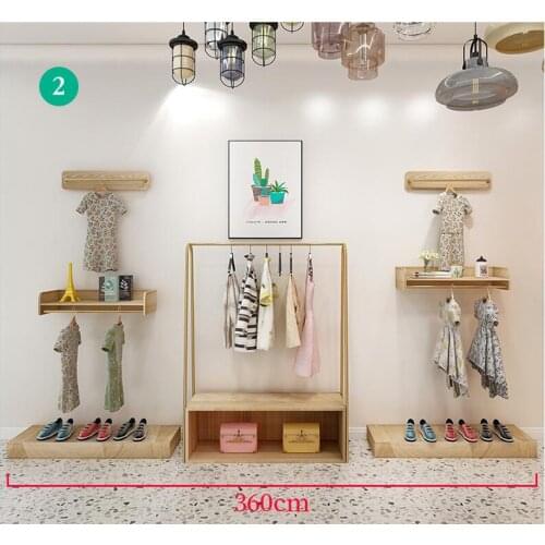 Clothes store shows shelf floor type childrens wear store web celebrity decorates special shelf aureate iron art to hang clothe