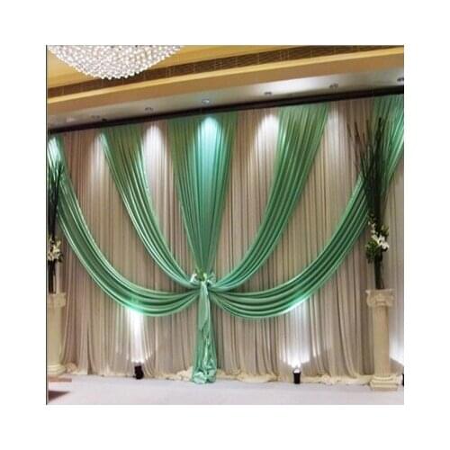 White Wedding backdrop with tiffany swags