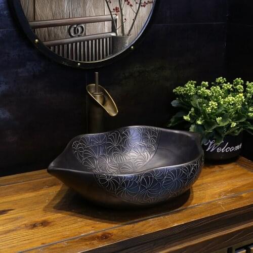 Black Leaf Retro Art oval-shaped Ceramic Washbasin Creative Ancient Face ceramic Wash basin bathroom sink